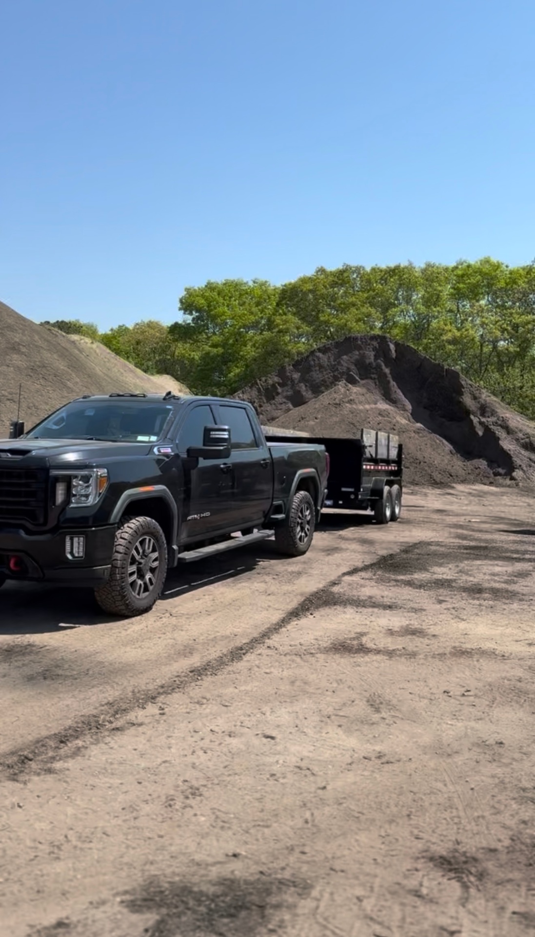 East End Stump & Dump truck and dump trailer at a Long Island job site